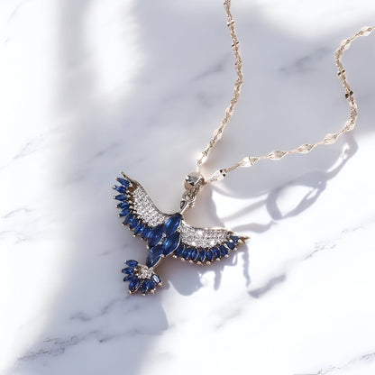 Elegant Silver & Blue Crystal Phoenix Necklace – Symbol of Strength & Beauty